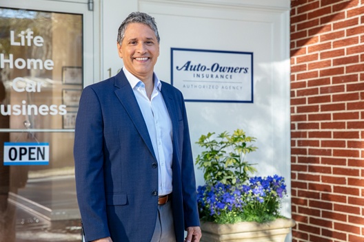 Man standing in front of business.