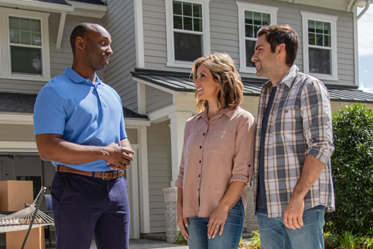man and woman talking to an insurance agent