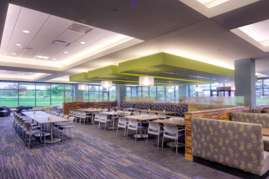 An office dining room with a variety of seating options. 	